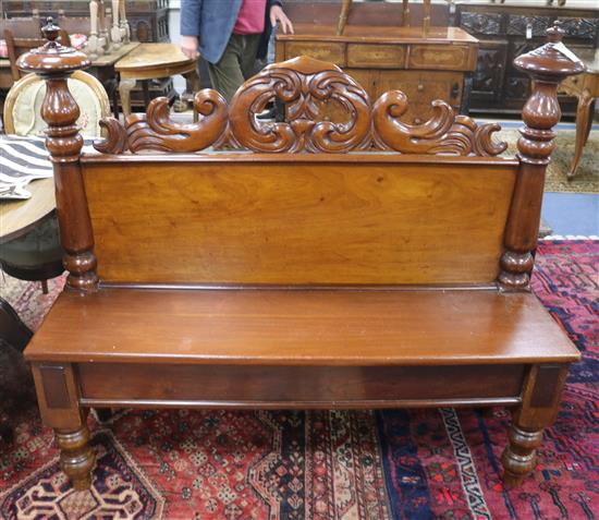 A Victorian carved mahogany wall seat W.137cm